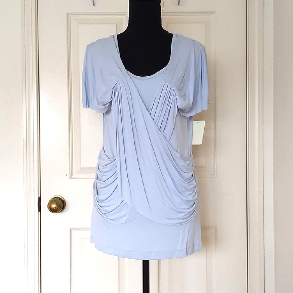 NWT. Kische Rayon Spandex Short Sleeve Top with 3D front and back design.